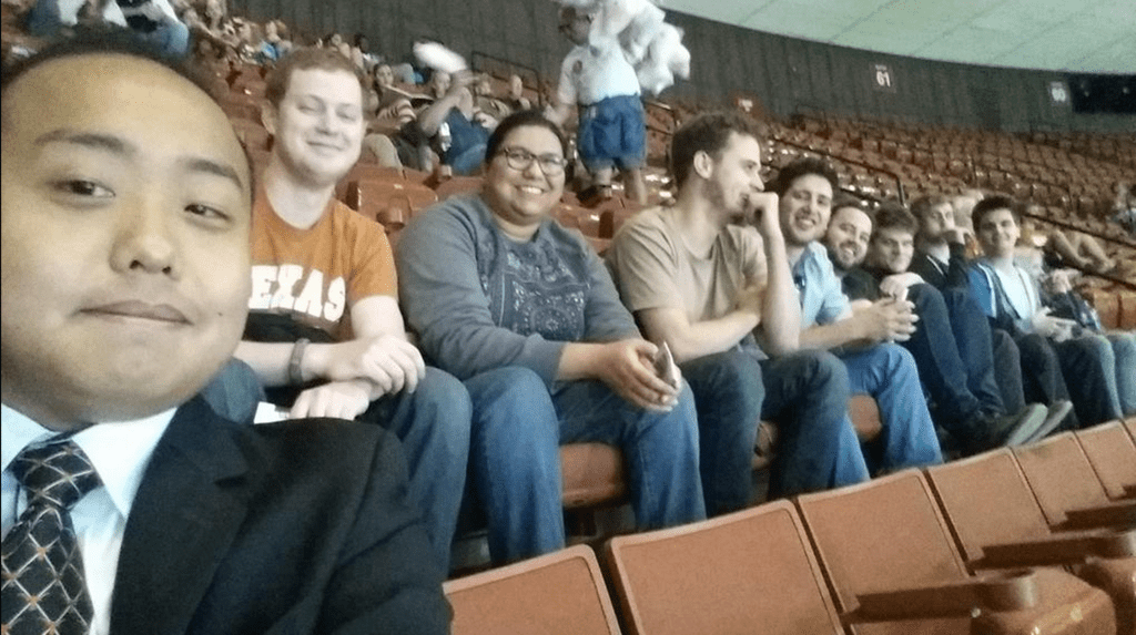 team seated in auditorium seats